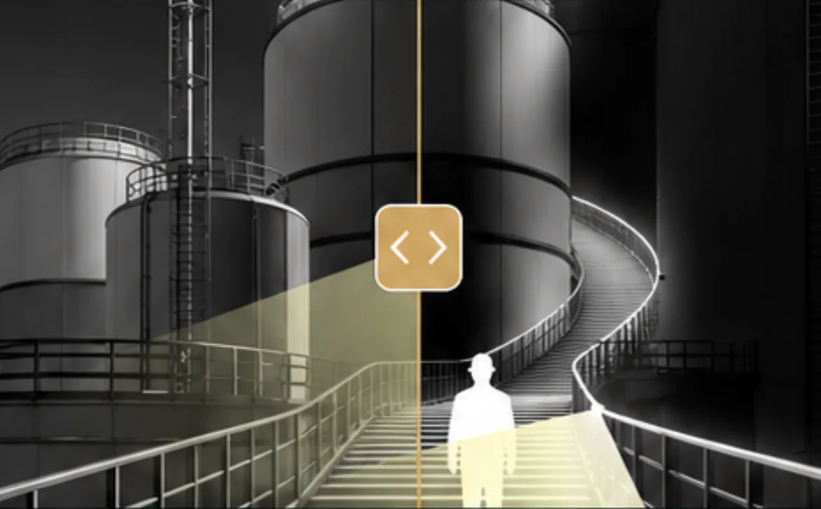 A tank-farm walkway shown half in darkness and half illuminated by SafeGlo edge lighting, marking a safe path between storage tanks at night.